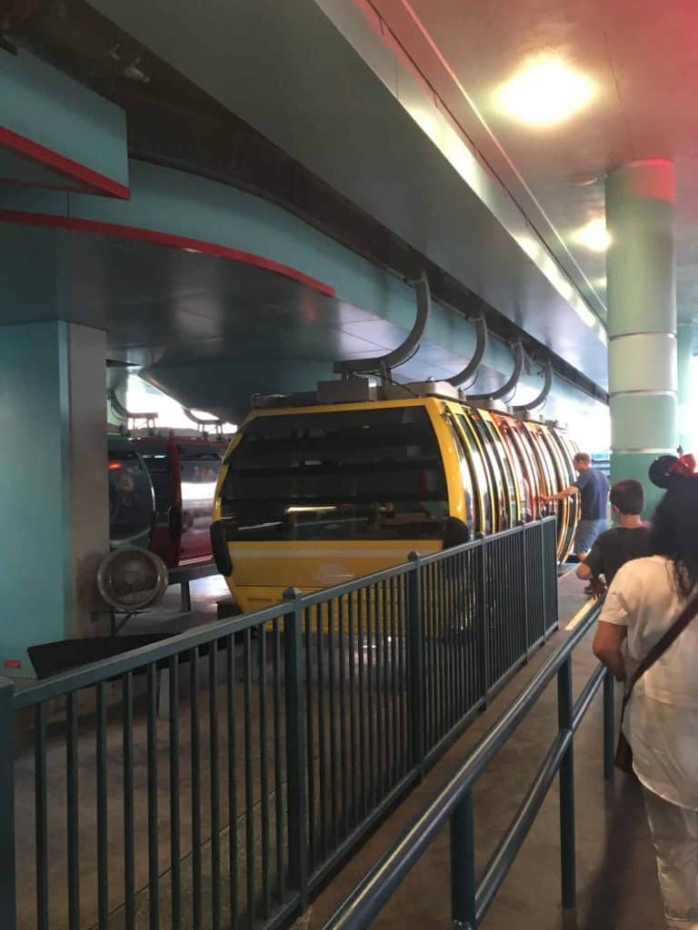 Disney Skyliner cars at a station